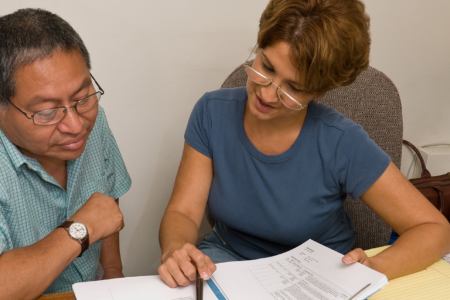 Man and woman signing a lease